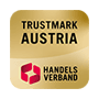 Goldfarbenes Gütesiegel mit der Aufschrift „Trustmark Austria“ und dem Logo des Handelsverbands.